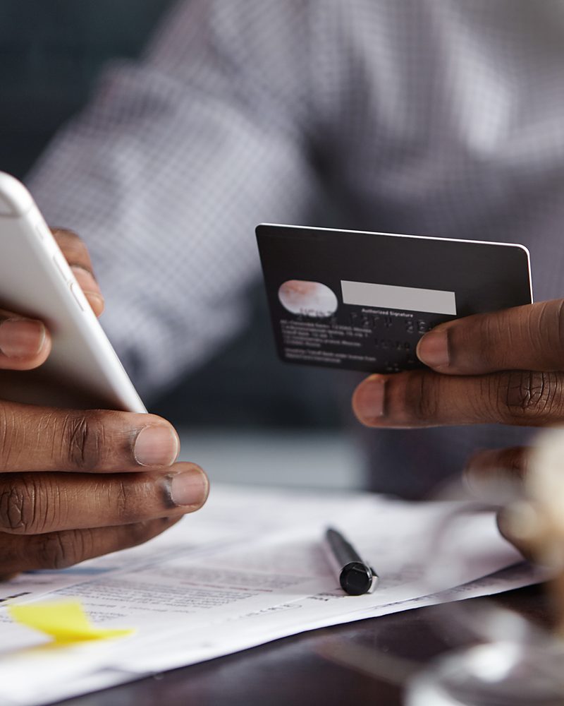 A customer paying online with a card and phone